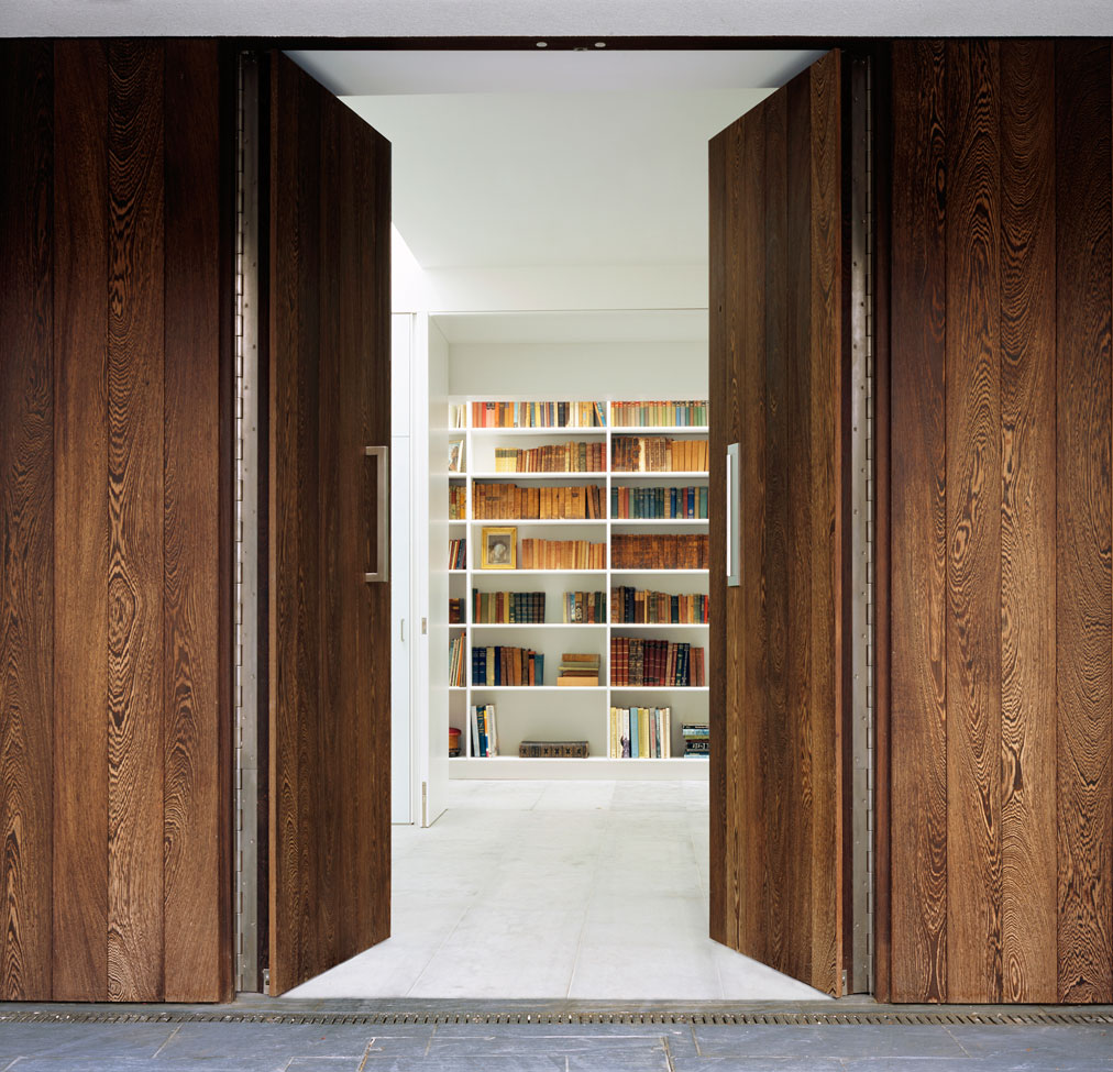 Willow House ajar entrance door and library view