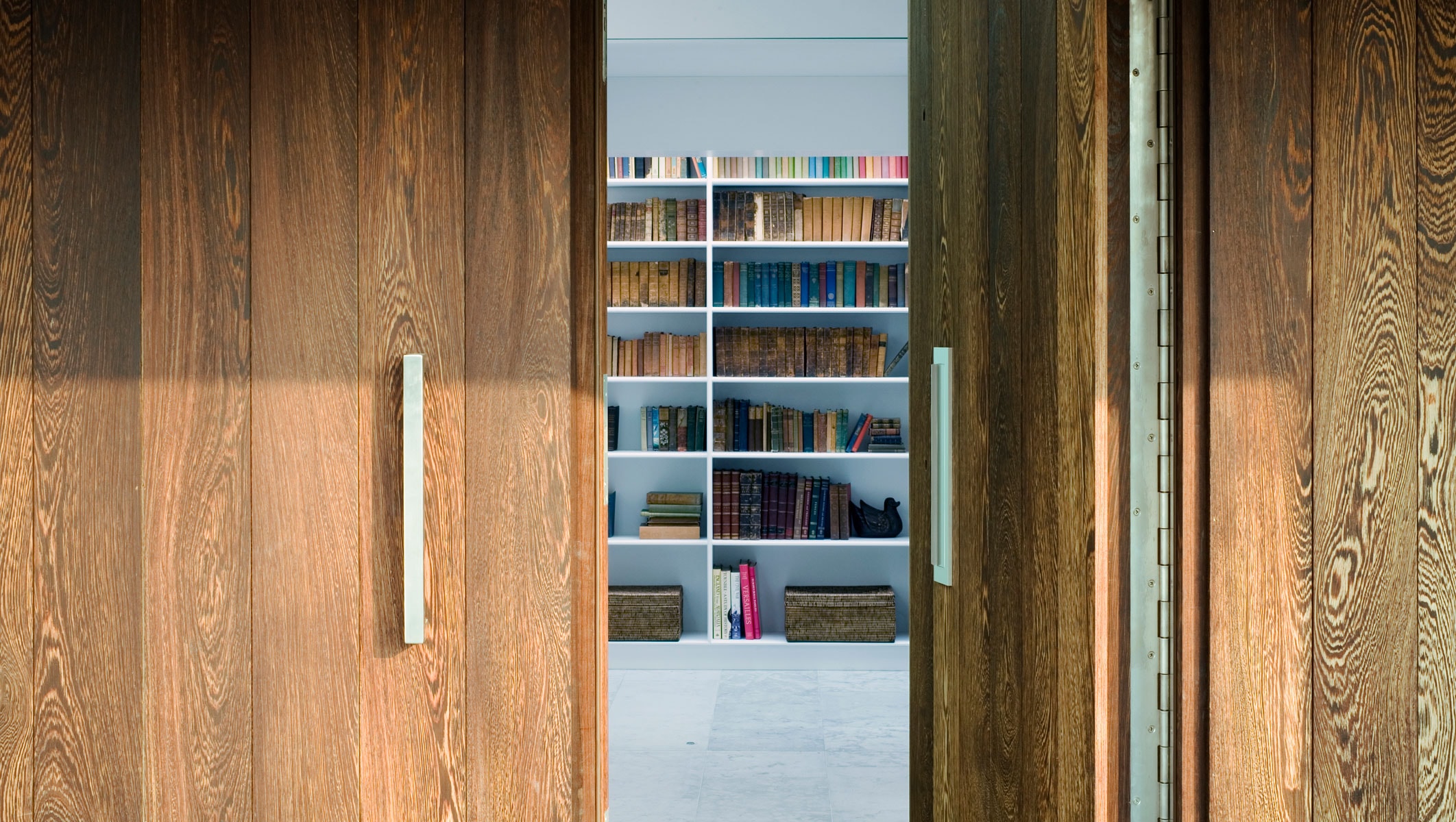 Willow House entrance door and library view